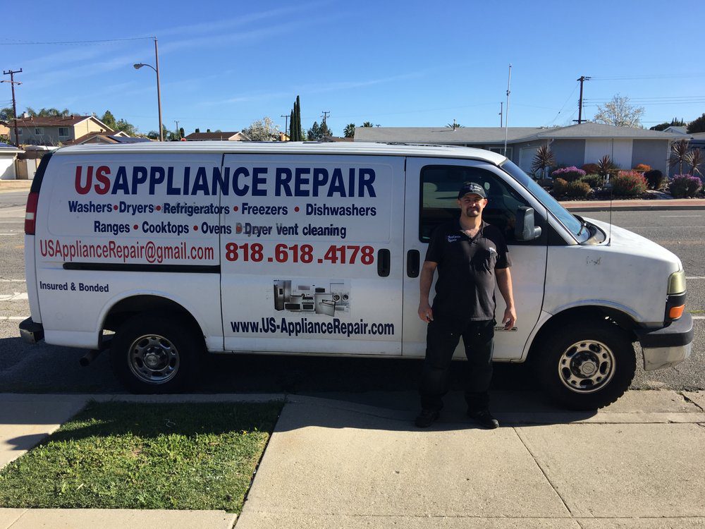 chris in front of us appliance repaitr work van